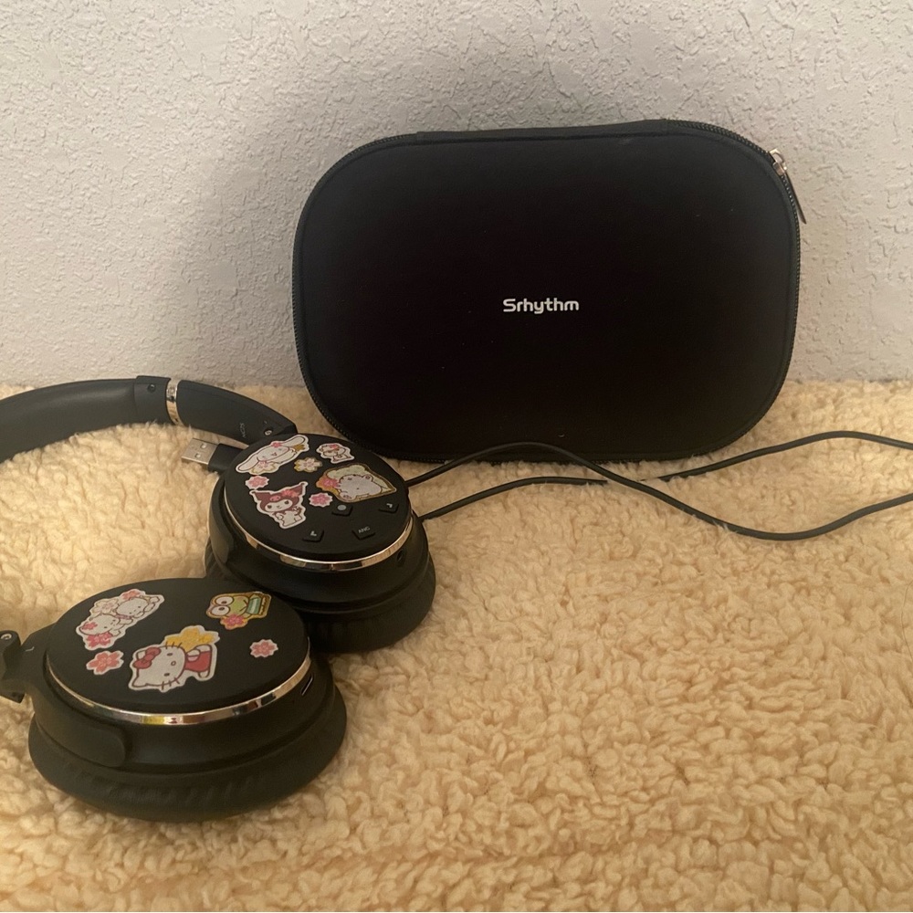 Srythm headphones with Sanrio stickers :) 🖤🖤